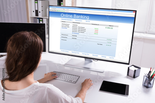 Businesswoman Doing Online Banking On Computer
