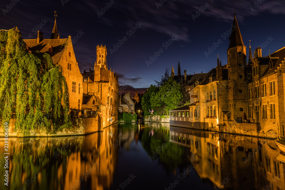 Reflections in canal in Bruges, Belgium during the night