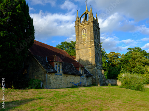 Late afternoon summer light on All Hallow's Church at Tillington next to the Petworth Estate in the South Downs National Park, West Sussex, UK photo