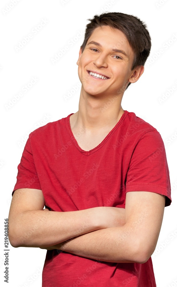 Young man smiling with his arms crossed Young man smiling with his arms crossed