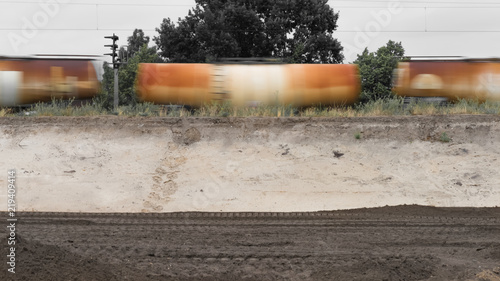 фотографія The freight train passes a construction site