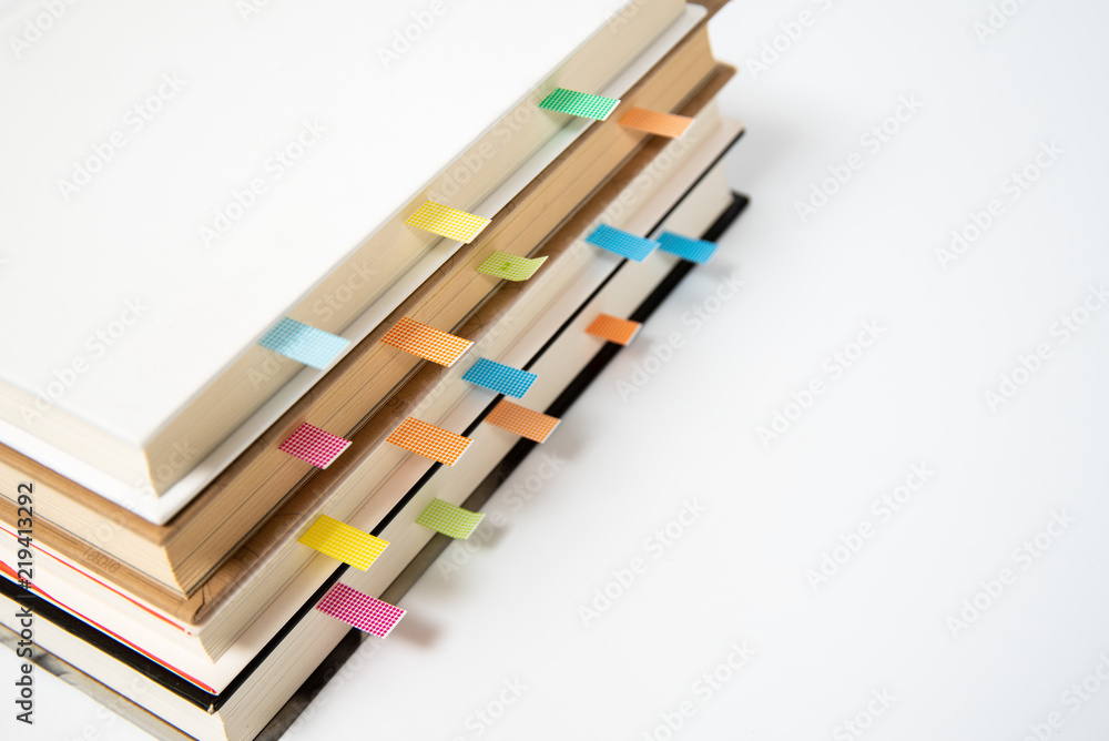 close up of book marked with placeholders on white background. close up of book marked with placeholders on white background.