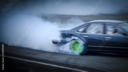 Side view car drifting on track with grain, Sport car wheel drifting and smoking on track.