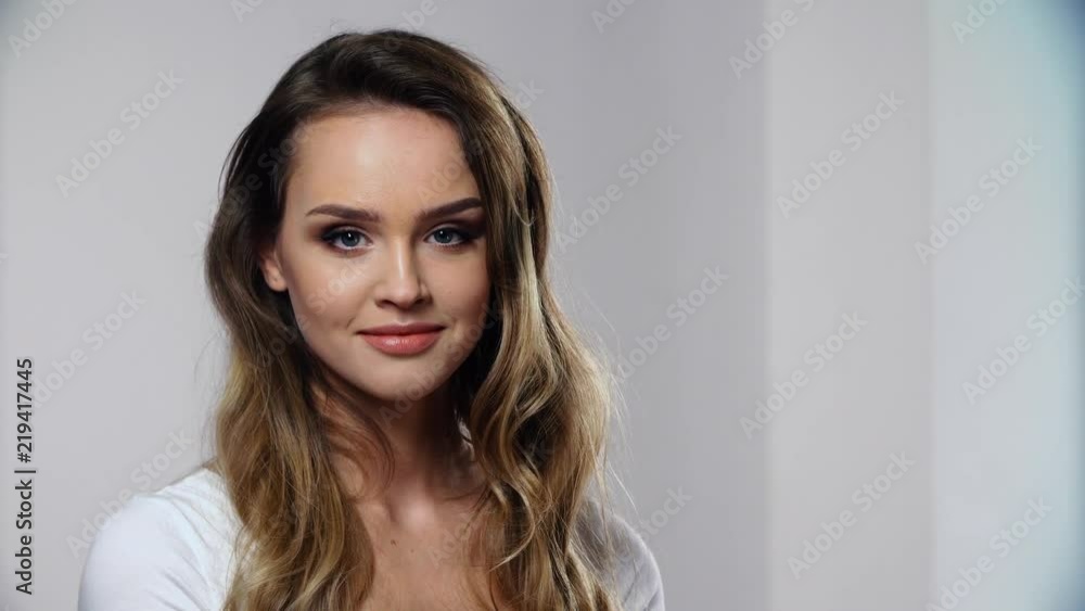 Woman With Beauty Face Makeup In White Interior Woman With Beauty Face Makeup In White Interior