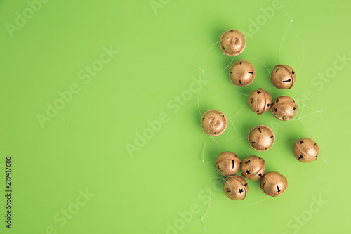 Christmas tree ornament jingle bells on colorful background photo