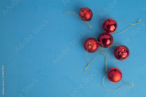 Christmas tree ornament jingle bells on colorful background