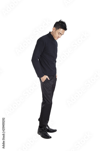 young casual man full body in a white background.