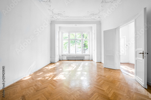 room in old apartment building with wooden parquet floor - real estate interior