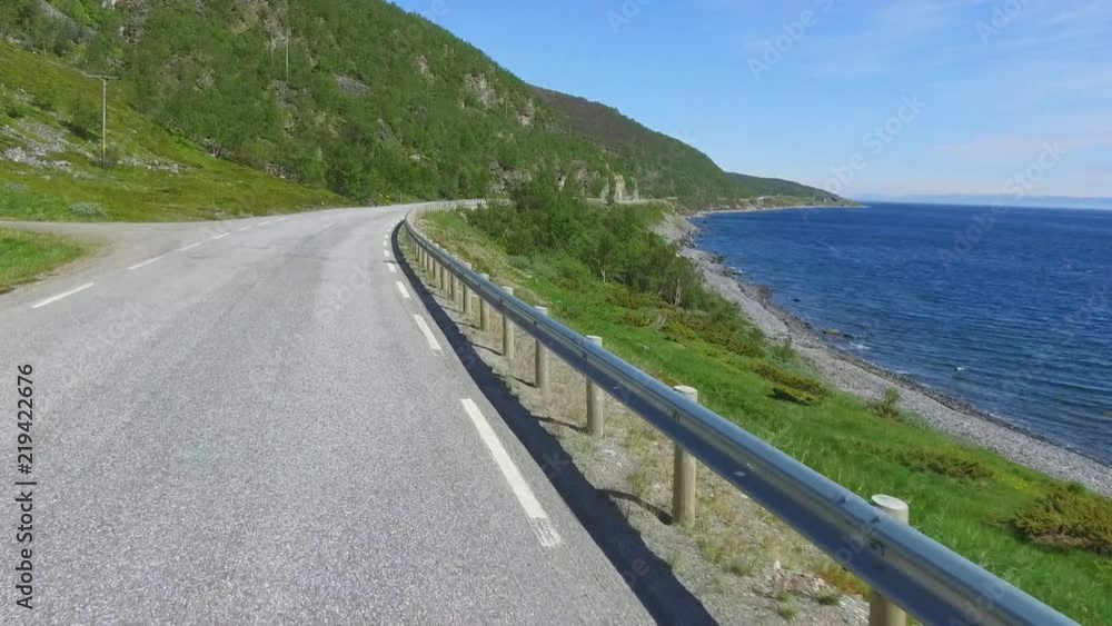 Beautiful road along the fjord in the northern part of Norway Beautiful road along the fjord in the northern part of Norway