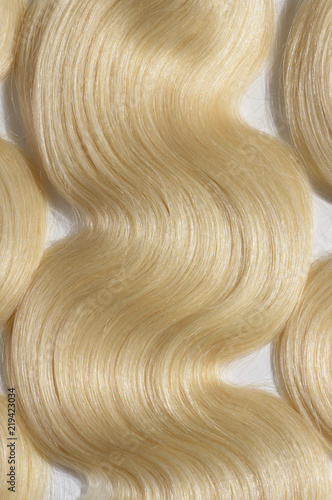 body wave wavy bleached blonde human hair weaves extensions bundles close up photo