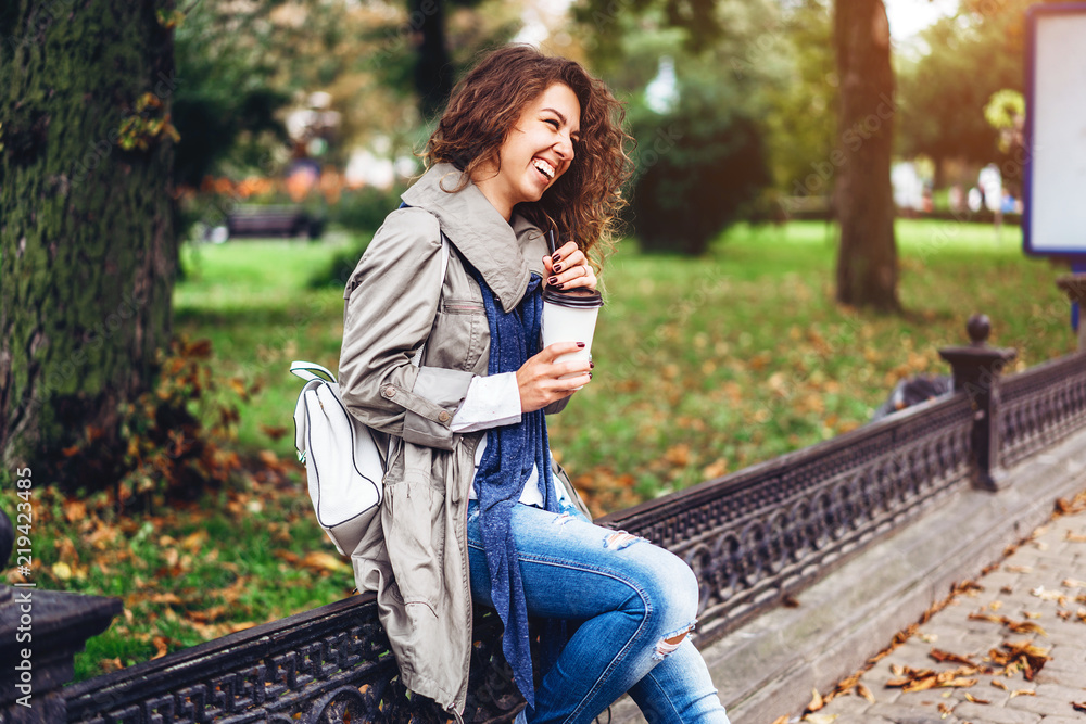 Happy girl with curly hair enjoy drink outdoor Happy girl with curly hair enjoy drink outdoor