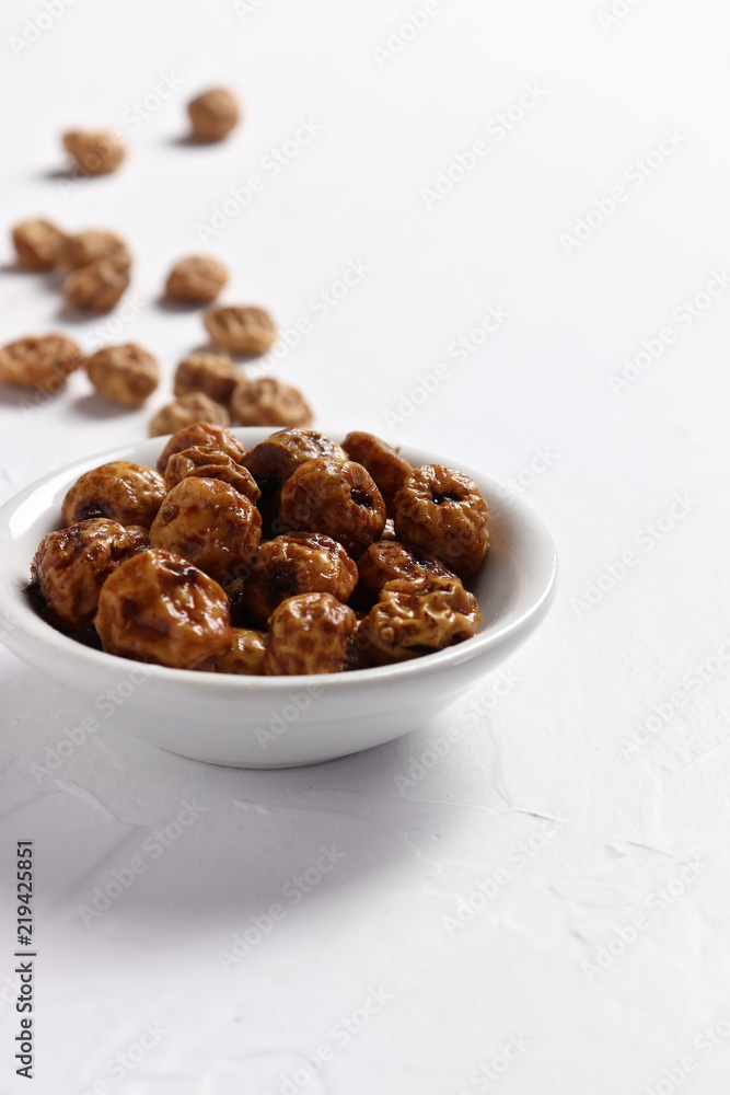 Soaked tiger nuts, used to make traditional Valencian horchata, closeup, copy space Soaked tiger nuts, used to make traditional Valencian horchata, closeup, copy space
