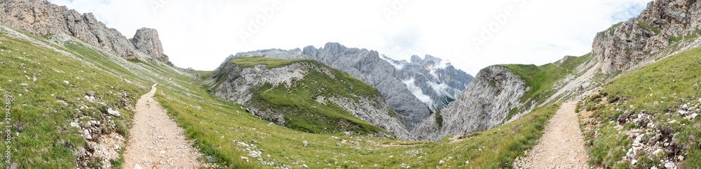Panorama view of mountains and  a hiking trail near Sciliar