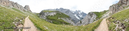 Panorama view of mountains and a hiking trail near Sciliar