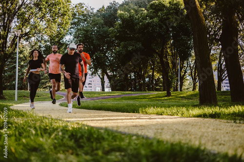 Group of people running in the park © sasamihajlovic