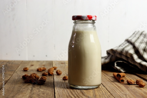 Traditional Spanish horchata made of tiger nuts, non-dairy milk, in a glass bottle, copy space photo