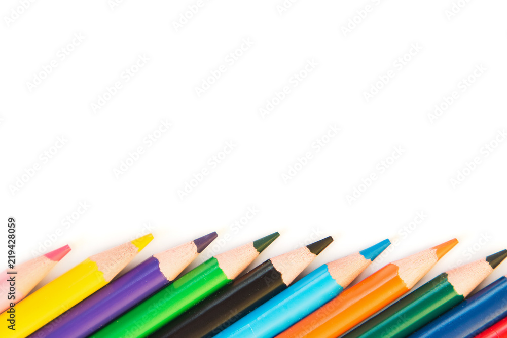 Color pencils in row isolated on white background.