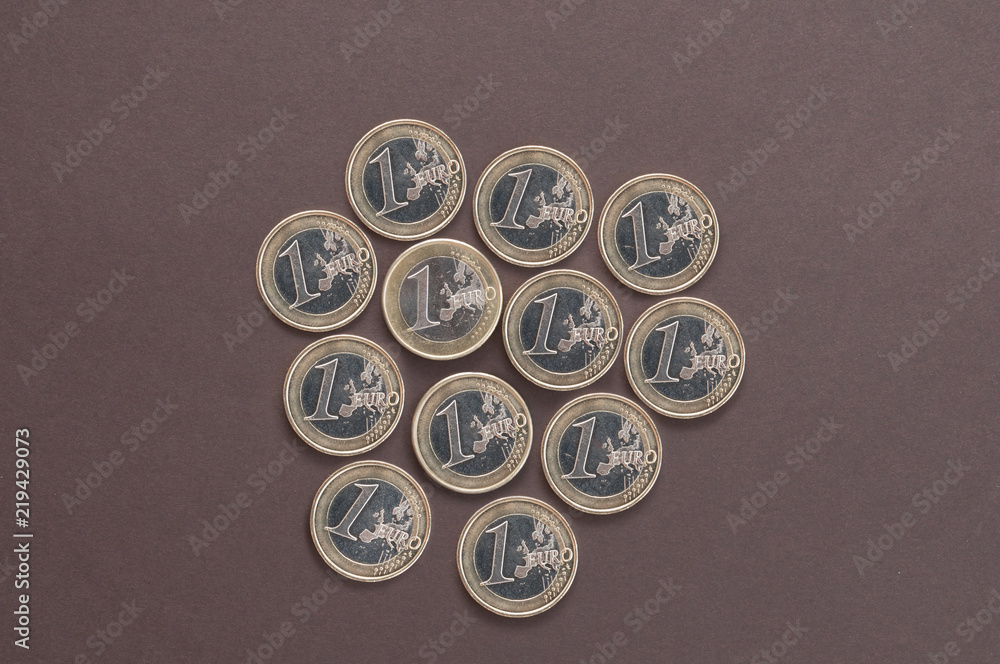twelve coins in one Euro on a dark background top view twelve coins in one Euro on a dark background top view