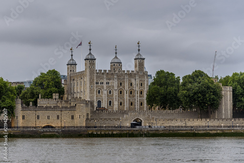 The Tower of London, on a cloudy day, as seen from the south bank of the River Thames