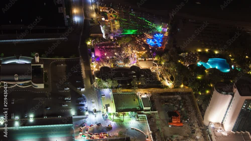 Dubai night beach club time lapse. pan up Dubai night beach club time lapse. pan up