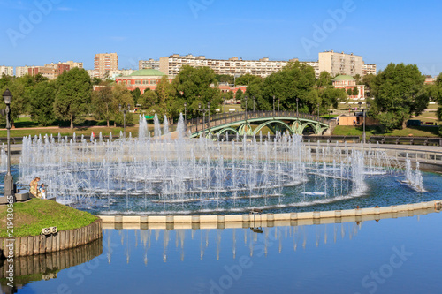 Light and music fountain on the island Horseshoe in Museum-reserve Tsaritsyno in Moscow at sunny summer morning
