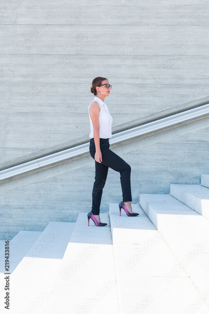 business woman climbs the stairs business woman climbs the stairs