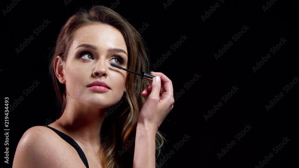 Eyelashes Makeup. Beautiful Woman Applying Mascara On Lashes Eyelashes Makeup. Beautiful Woman Applying Mascara On Lashes