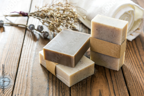 Handmade natural soap on wooden background photo