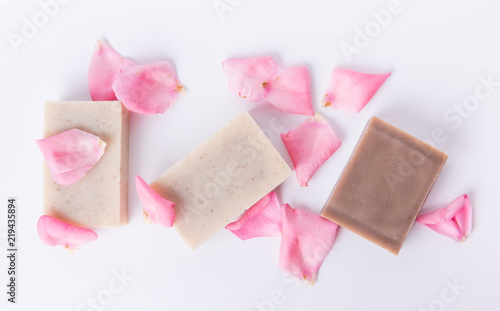 Top view of handmade soap with flower petals on white background © ddukang