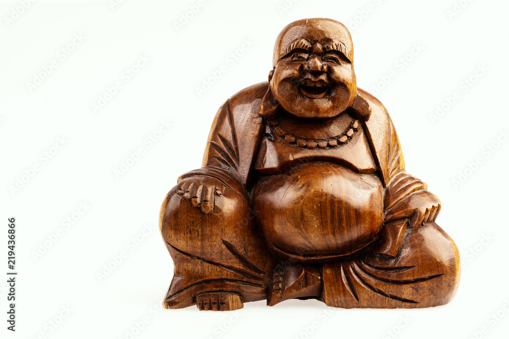 isolated wooden statuette of a happy buddha on a white background isolated wooden statuette of a happy buddha on a white background