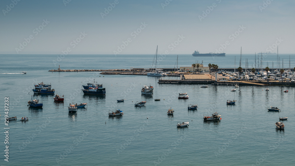 Fishing boats floating in the fish port of Cascais - Portugal
