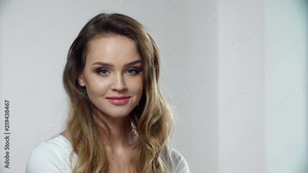 Woman With Beauty Face Makeup In White Interior Woman With Beauty Face Makeup In White Interior