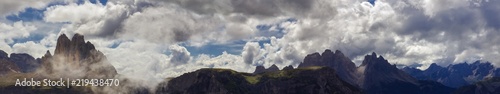 Panoramic view of the Three Peaks in wispy clouds, the most famous hiking destination and landmark of the italian dolomites