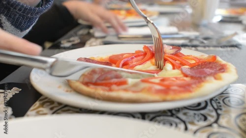 Children make a pizza with his own hands in the restaurant photo