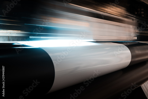 High quality professional printing facility in Europe, Italy. Advanced digital and robotized processing. Close up shot of moving chassis and print head.