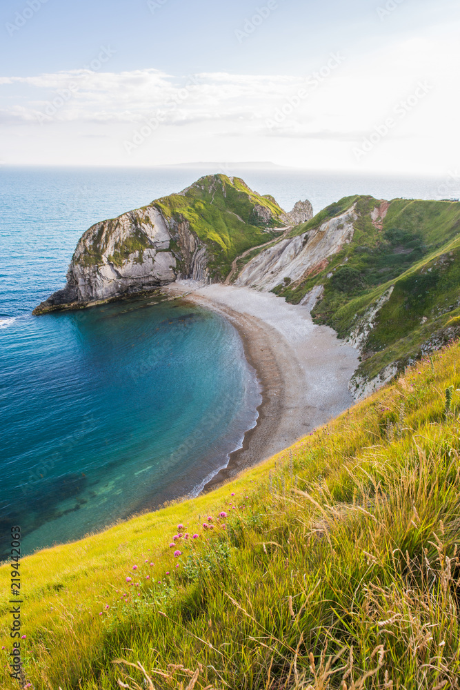 Man of War Beach on West Lulworth Cove and Durdle Door at Sunset.