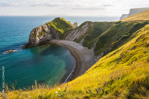 Man of War Beach on West Lulworth Cove and Durdle Door at Sunset.