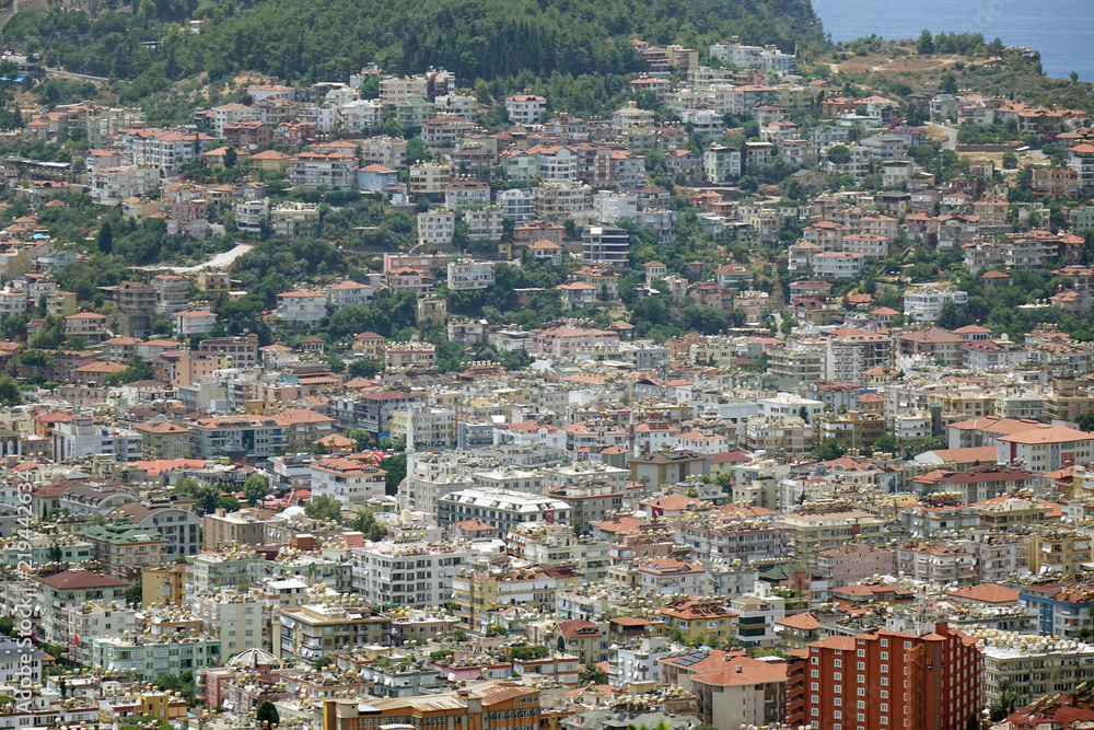 Panorama of the city. Numerous houses of the coastal city. The view from the height of bird flight.