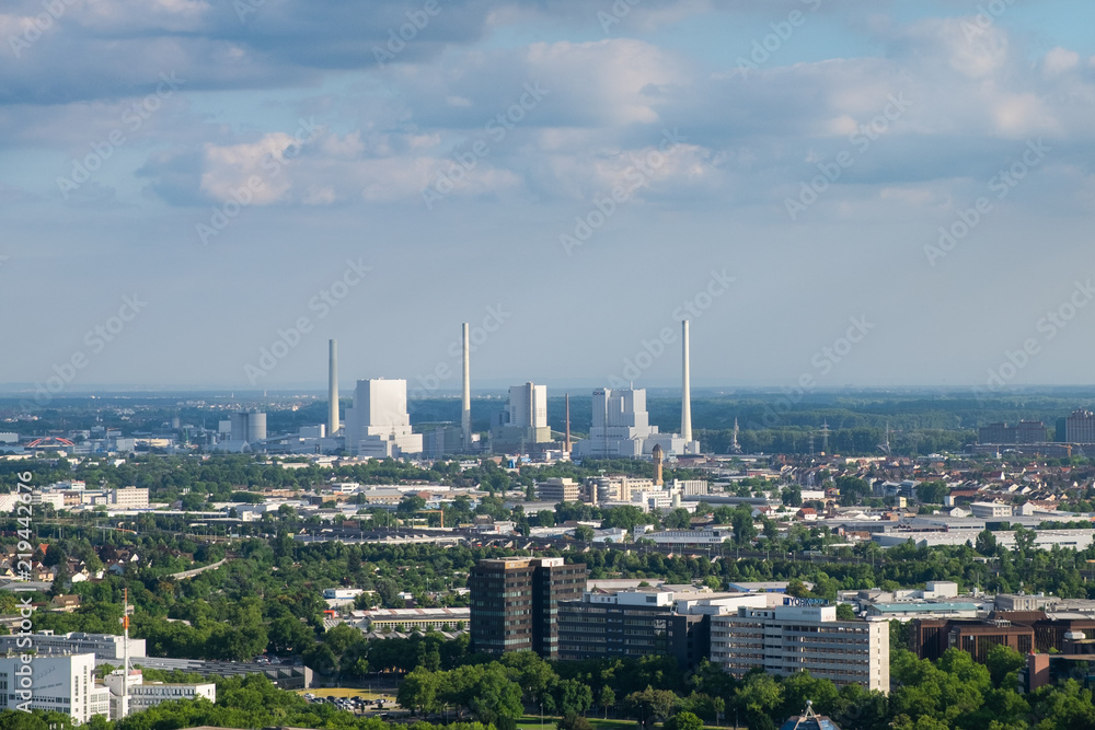 The aerial view of the area around Manheim city from above, with nuclear power plant in the distance. Shot on a sunny summer day from the telecommunication tower.