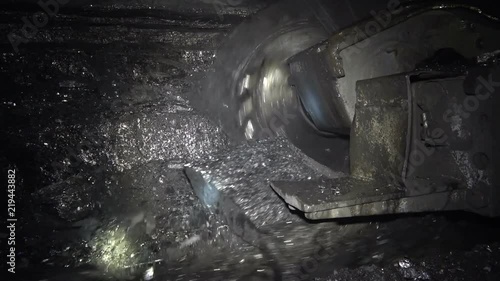 Coal miner produces coal. Coal mining in a real mine
