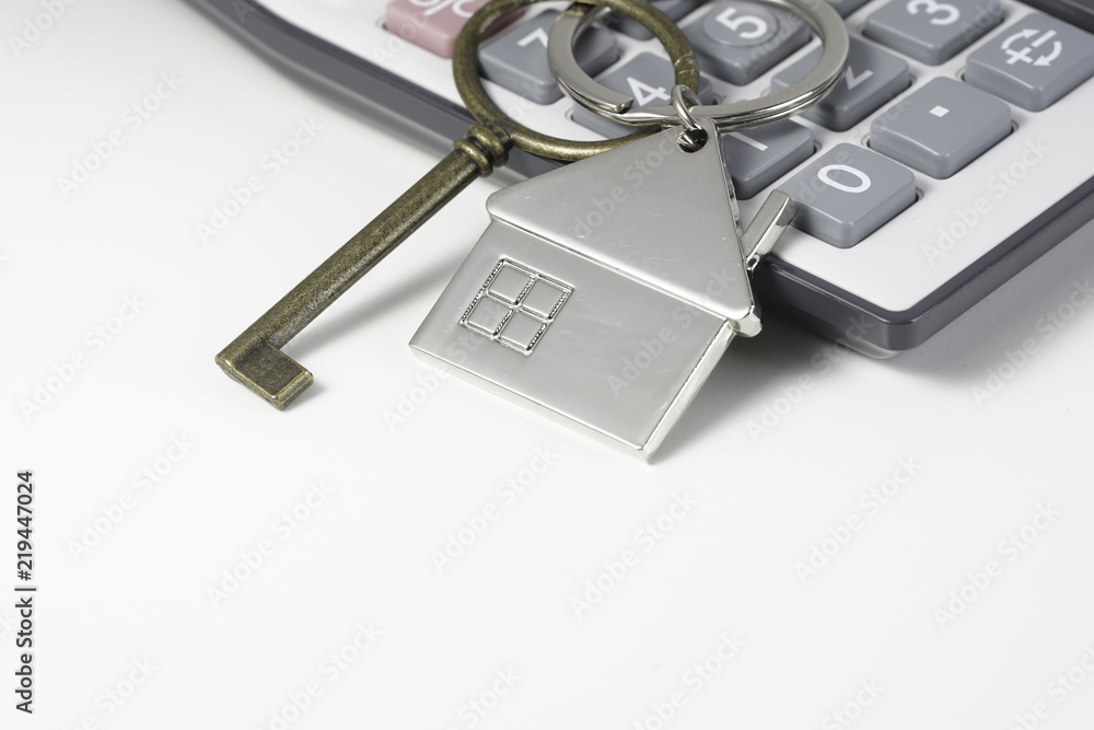 House key chain, bronze key and calculator House key chain, bronze key and calculator