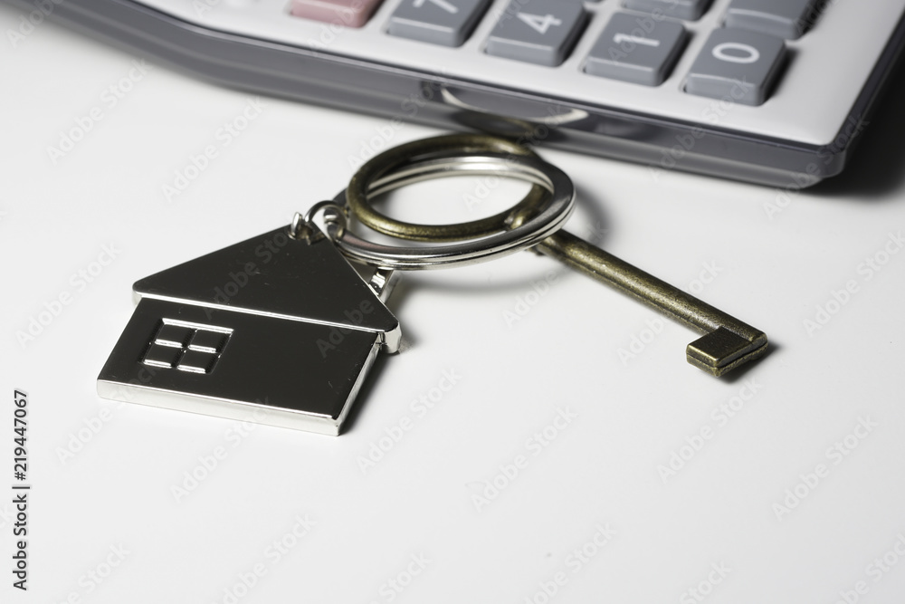 House key chain, bronze key and calculator House key chain, bronze key and calculator