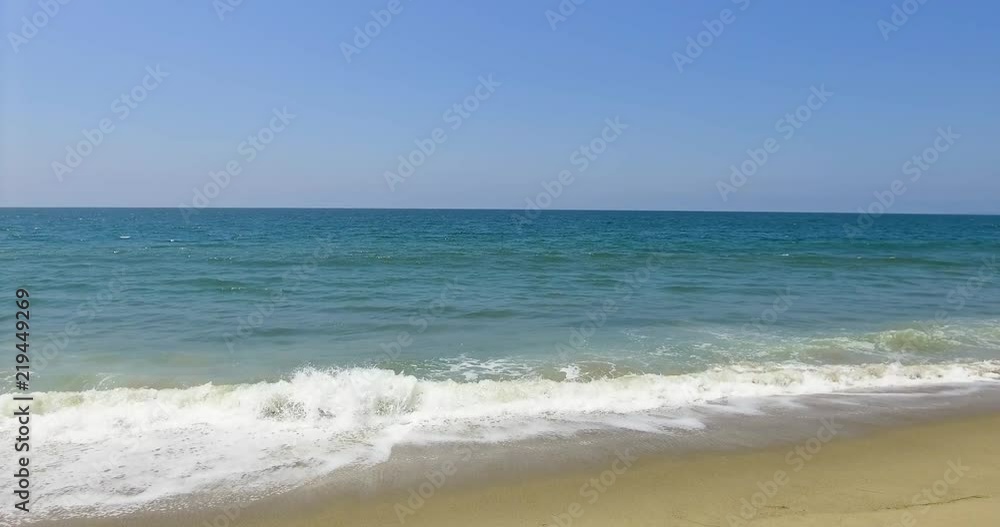 Waves crashing at high tide on a sunny summer day in Santa Monica Waves crashing at high tide on a sunny summer day in Santa Monica
