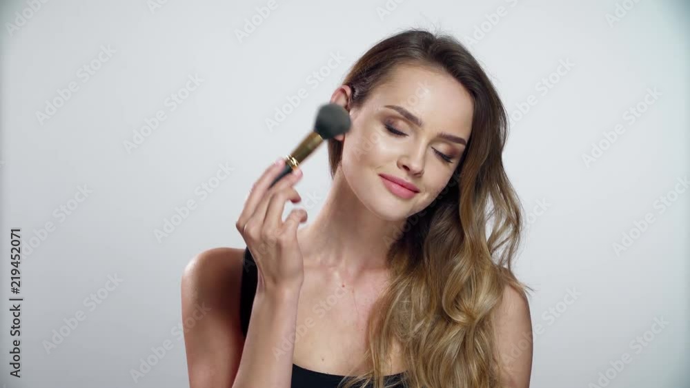 Woman With Beauty Makeup Using Facial Powder With Brush Woman With Beauty Makeup Using Facial Powder With Brush