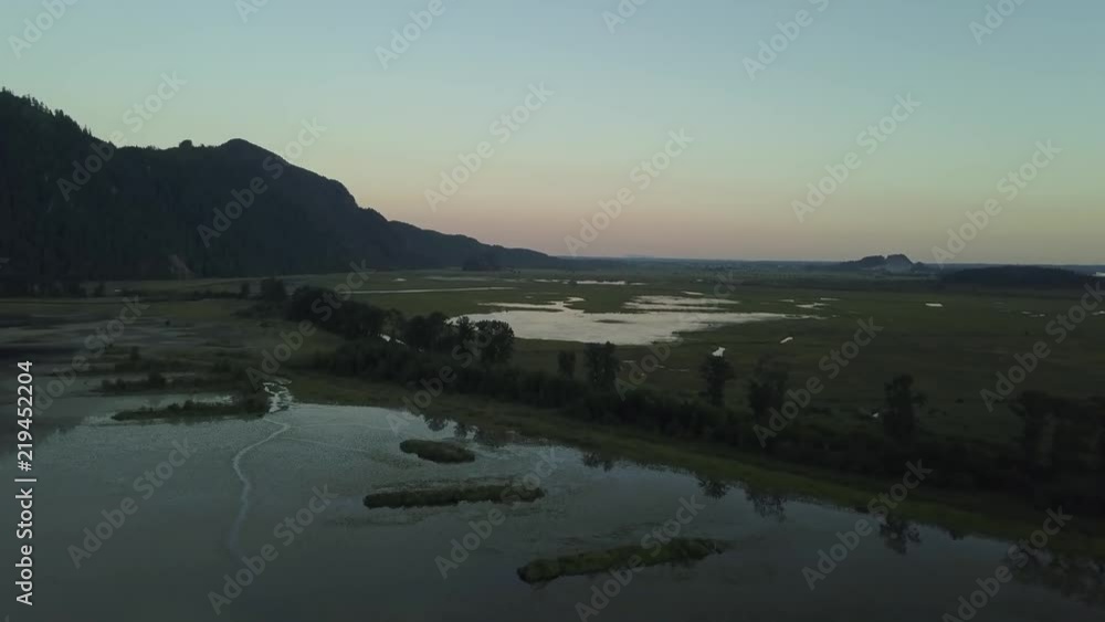 Aerial view of Pitt Lake during a vibrant summer sunset. Taken in Maple Ridge, Greater Vancouver, BC, Canada. Aerial view of Pitt Lake during a vibrant summer sunset. Taken in Maple Ridge, Greater Vancouver, BC, Canada.
