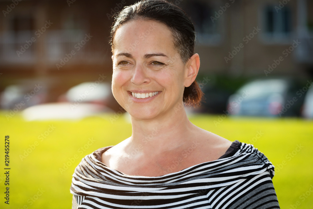 Mature Spanish woman smiling at the park Mature Spanish woman smiling at the park