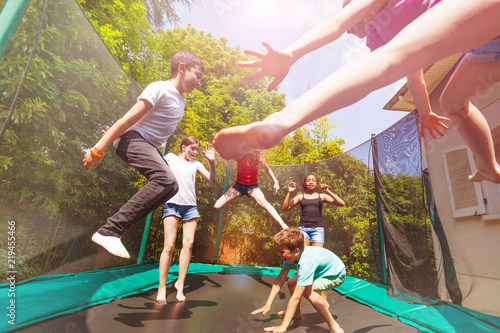 Boys and girls playing on the outdoor trampoline