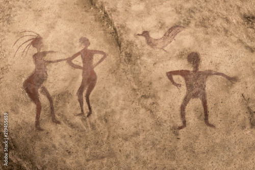 image of ancient people on the wall of a cave painted with ocher. ancient history. era, era.