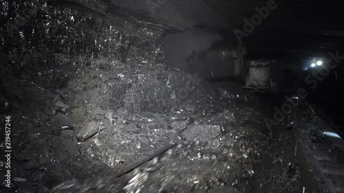 Coal miner produces coal. Coal mining in a real mine