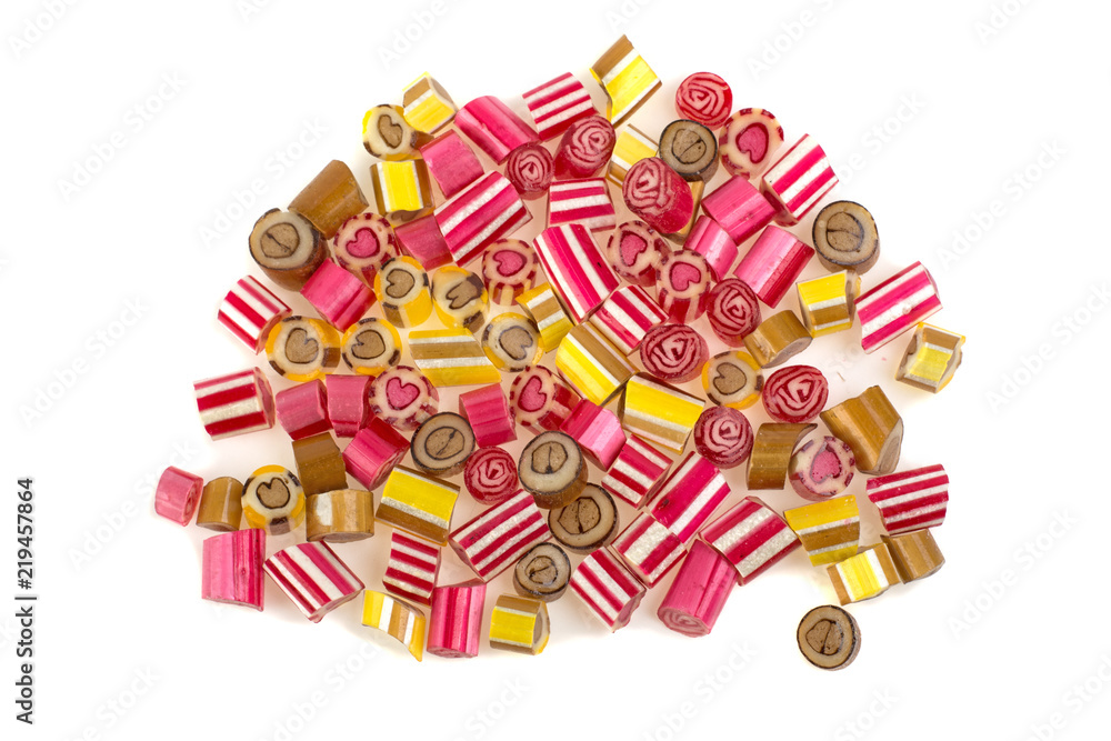 a pile of colorful lollies on a white background